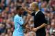 MANCHESTER, ENGLAND - SEPTEMBER 23: Raheem Sterling of Manchester City is embraced by manager Josep Guardiola after substituted during the Premier League match between Manchester City and Crystal Palace at Etihad Stadium on September 23, 2017 in Manchest