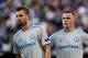 Everton's French midfielder Morgan Schneiderlin (L) and English forward Wayne Rooney look on during the UEFA Europa League Group E football match Atalanta vs Everton at The Stadio Città del Tricolore in Reggio Emilia on September 14, 2017. / AFP PHOTO / M