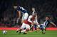 LONDON, ENGLAND - SEPTEMBER 25: Alexandre Lacazette of Arsenal is challenged by Ahmed El-Sayed Hegazi and Kieran Gibbs of West Bromwich Albion during the Premier League match between Arsenal and West Bromwich Albion at Emirates Stadium on September 25, 2