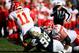 SAN DIEGO, CA - JANUARY 01: Joey Bosa #99 of the San Diego Chargers sacks Alex Smith #11 with Eric Fisher #72 of the Kansas City Chiefs too late to stop the hit during the first half of a game at Qualcomm Stadium on January 1, 2017 in San Diego, Californi