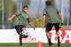 Juventus' Argentinian forward Paulo Dybala (L) takes part in a training session on the eve of the UEFA Champions League football match between Juventus and Olympiacos Piraeus FC on September 26, 2017 in Vinovo, near Turin. / AFP PHOTO / MARCO BERTORELLO