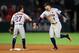 ANAHEIM, CA - SEPTEMBER 12: Jose Altuve #27 and George Springer #4 of the Houston Astros celebrate defeating the Los Angeles Angels of Anaheim 1-0 in a game at Angel Stadium of Anaheim on September 12, 2017 in Anaheim, California. (Photo by Sean M. Haff