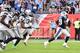 NASHVILLE, TN - SEPTEMBER 24: DeMarco Murray #29 of the Tennessee Titans runs past a group of the Seattle Seahawks for a touchdown during the second half at Nissan Stadium on September 24, 2017 in Nashville, Tennessee. (Photo by Frederick Breedon/Getty