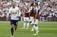 Tottenham Hotspur's Danish midfielder Christian Eriksen celebrates after scoring during the English Premier League football match between West Ham United and Tottenham Hotspur at The London Stadium, in east London on September 23, 2017. / AFP PHOTO / Ian