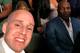 Oliver, sitting ringside at the McGregor-Mayweather fight, poses for a selfie with Mike Tyson (right).