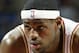CLEVELAND - DECEMBER 26: LeBron James #23 of the Cleveland Cavaliers rests during the game against the Chicago Bulls at the Gund Arena on December 26, 2003 in Cleveland, Ohio. The Bulls won 87-80. NOTE TO USER: User expressly acknowledges and agrees t