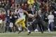 Sam Darnold spent plenty of time running for his life Friday night.