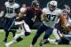 HOUSTON, TX - OCTOBER 01: Deshaun Watson #4 of the Houston Texans rushes with the ball as Karl Klug #97 of the Tennessee Titans pursues in the second quarter at NRG Stadium on October 1, 2017 in Houston, Texas. (Photo by Bob Levey/Getty Images)