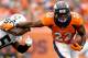 DENVER, CO - OCTOBER 01: C.J. Anderson #22 of the Denver Broncos tries to break free from Nicholas Morrow #50 of the Oakland Raiders at Sports Authority Field at Mile High on October 1, 2017 in Denver, Colorado. (Photo by Matthew Stockman/Getty Images)