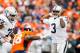 DENVER, CO - OCTOBER 1: Quarterback EJ Manuel #3 of the Oakland Raiders looks passes against the Denver Broncos in the third quarter of a game at Sports Authority Field at Mile High on October 1, 2017 in Denver, Colorado. (Photo by Justin Edmonds/Getty I