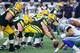 ARLINGTON, TX - JANUARY 15: Corey Linsley #63 of the Green Bay Packers gets set to snap the ball during the NFC Divisional Playoff game against the Dallas Cowboys at AT&T Stadium on January 15, 2017 in Arlington, Texas. The Packers defeated the Cowboys 34