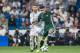 MADRID, SPAIN - SEPTEMBER 20: Arnaldo Antonio Sanabria Ayala (r) of Real Betis fights for the ball with Sergio Ramos of Real Madrid during the La Liga 2017-18 match between Real Madrid and Real Betis at Estadio Santiago Bernabeu on 20 September 2017 in Ma