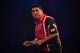 LONDON, ENGLAND - DECEMBER 21: Mensur Suljovic of Serbia reacts during his first round match against Ron Meulenkamp of the Netherlands on day seven of the 2017 William Hill PDC World Darts Championships at Alexandra Palace on December 21, 2016 in London,