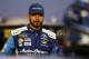 CHARLOTTE, NC - OCTOBER 06: Martin Truex Jr., driver of the #78 Auto-Owners Insurance Toyota, stands on the grid during qualifying for the Monster Energy NASCAR Cup Series Bank of America 500 at Charlotte Motor Speedway on October 6, 2017 in Charlotte, N