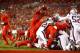 TAMPA, FL - OCTOBER 5: Running back Doug Martin #22 of the Tampa Bay Buccaneers goes over the top on a one-yard rush for a touchdown during the second quarter of an NFL football game against the New England Patriots on October 5, 2017 at Raymond James St