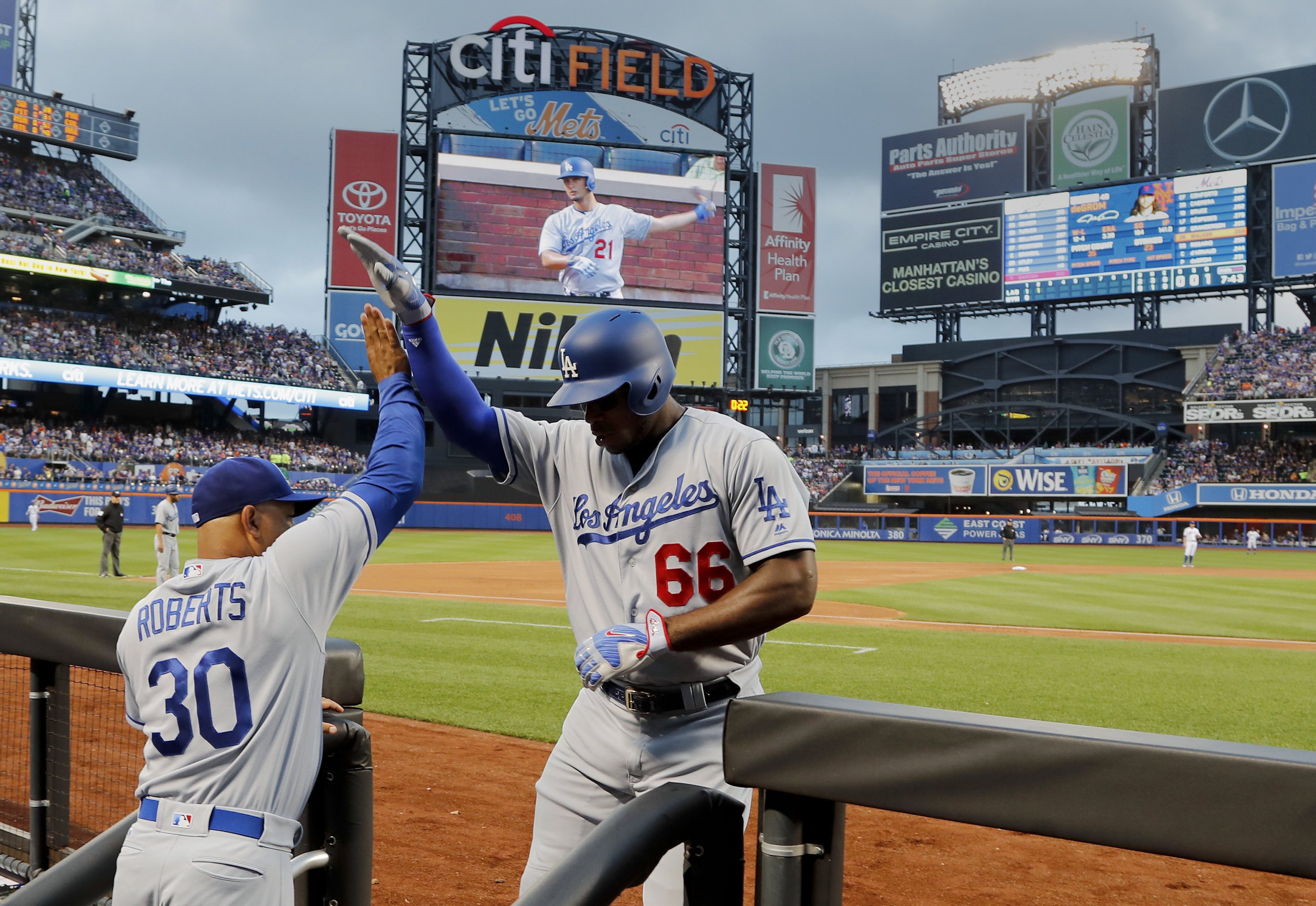 Dodgers' Yasiel Puig launches himself tongue-first into October baseball