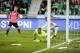 LJUBLJANA, SLOVENIA - OCTOBER 08: Leigh Griffiths (L) of Scotland scores the opening goal near goalkeeper Jan Oblak (R) of Slovenia during the FIFA 2018 World Cup Qualifier match between Slovenia and Scotland at stadium Stozice on October 08, 2017 in Ljub