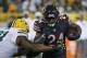 GREEN BAY, WI - SEPTEMBER 28: Jordan Howard #24 of the Chicago Bears is grabbed by Quinton Dial #91 of the Green Bay Packers at Lambeau Field on September 28, 2017 in Green Bay, Wisconsin. The Packers defeated the Bears 35-14. (Photo by Jonathan Daniel/