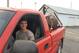 Senior Colton Younger-Loesing rides with farm equipment in the bed of his truck.