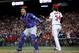 WASHINGTON, DC - OCTOBER 13: Willson Contreras #40 of the Chicago Cubs celebrates next to Bryce Harper #34 of the Washington Nationals after Harper struck out to end Game 5 of the National League Divisional Series at Nationals Park on October 13, 2017 in