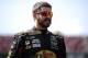 TALLADEGA, AL - OCTOBER 13: Martin Truex Jr., driver of the #78 Bass Pro Shops/Tracker Boats Toyota, stands in the garage area during practice for the Monster Energy NASCAR Cup Series Alabama 500 at Talladega Superspeedway on October 13, 2017 in Talladeg
