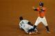HOUSTON, TX - OCTOBER 13: Jose Altuve #27 of the Houston Astros steals second against Starlin Castro #14 of the New York Yankees in the fourth inning during game one of the American League Championship Series at Minute Maid Park on October 13, 2017 in Ho