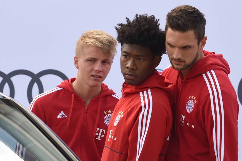 (L-R) Bayern Munich's defender Felix Goetze, Bayern Munich's Austrian defender David Alaba and Bayern Munich's Goalkeeper Sven Ulreich are pictured during a car handover event at the Audi headquarters in Ingolstadt, southern Germany, on October 11, 2017.
