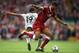 LIVERPOOL, ENGLAND - OCTOBER 14: Marcus Rashford of Manchester United and Joe Gomez of Liverpool battle for possession during the Premier League match between Liverpool and Manchester United at Anfield on October 14, 2017 in Liverpool, England. (Photo by