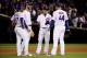 CHICAGO, IL - OCTOBER 18: Kris Bryant #17, Addison Russell #27, Javier Baez #9, and Anthony Rizzo #44 of the Chicago Cubs meet during a pitching change in the seventh inning against the Los Angeles Dodgers during game four of the National League Champion