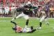 GLENDALE, AZ - OCTOBER 15: Adrian Peterson #23 of the Arizona Cardinals leaps over a tackle by Vernon Hargreaves III #28 of the Tampa Bay Buccaneers during the second quarter at University of Phoenix Stadium on October 15, 2017 in Glendale, Arizona. (Ph