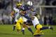 STATE COLLEGE, PA - OCTOBER 21: Saquon Barkley #26 of the Penn State Nittany Lions runs after making a catch in the first half against Khaleke Hudson #7 and Noah Furbush #59 of the Michigan Wolverines on October 21, 2017 at Beaver Stadium in State Colleg