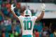 MIAMI GARDENS, FL - OCTOBER 08: Kenny Stills #10 of the Miami Dolphins celebrates a touchdown by Jarvis Landry #14 in the fourth quarter against the Tennessee Titans on October 8, 2017 at Hard Rock Stadium in Miami Gardens, Florida. (Photo by Mike Ehrm