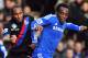 Crystal Palace's English striker Cameron Jerome (L) vies with Chelsea's Ghanaian midfielder Michael Essien (R) during the English Premier League football match between Chelsea and Crystal Palace at Stamford Bridge in London on December 14, 2013. Chelsea w