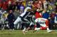 KANSAS CITY, MO - DECEMBER 25: Quarterback Alex Smith #11 of the Kansas City Chiefs is tackled by inside linebacker Todd Davis #51 and inside linebacker Corey Nelson #52 of the Denver Broncos on a keeper during the game at Arrowhead Stadium on December 2