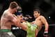 Machida fires a body kick at opponent CB Dollaway.