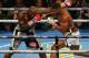 Cameroon-born Carlos Takam (L) exchanges blows with Britain's Anthony Joshua (R) during their world heavyweight title fight at The Principality Stadium in Cardiff on October 28, 2017.
Joshua stopped Takam in 10th round to retain his championship belts. /