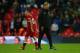 LONDON, ENGLAND - OCTOBER 22: Jurgen Klopp the head coach / manager of Liverpool walks past Philippe Coutinho of Liverpool after the Premier League match between Tottenham Hotspur and Liverpool at Wembley Stadium on October 22, 2017 in London, England. (P