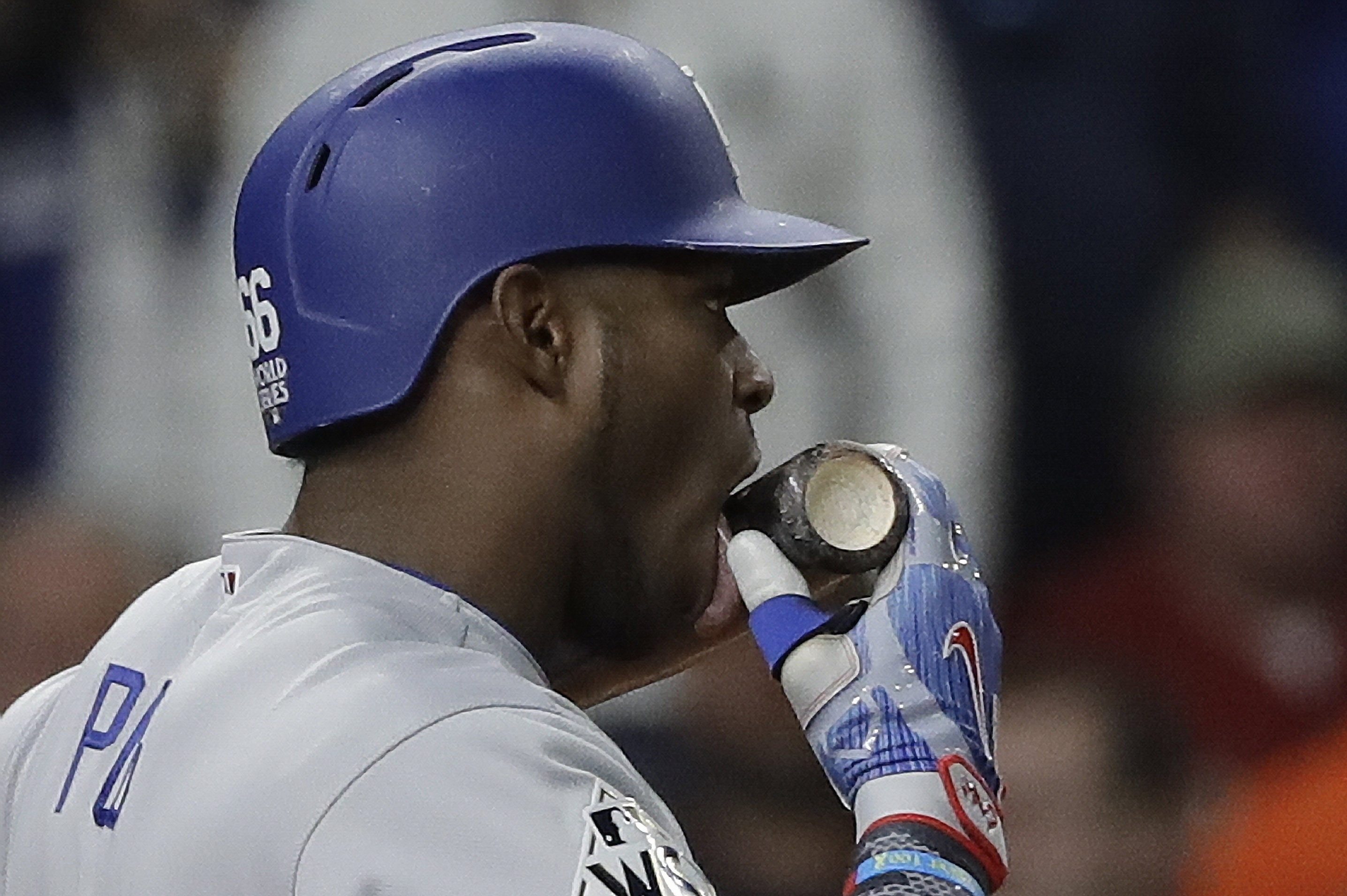 Yasiel Puig tried to break his bat over his knee, but couldn't quite pull  it off