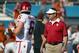 DALLAS, TX - OCTOBER 10: Head coach Bob Stoops of the Oklahoma Sooners looks on as Baker Mayfield #6 of the Oklahoma Sooners works through pregame warmups before taking on the Texas Longhorns during the AT&T Red River Showdown at the Cotton Bowl on Octob