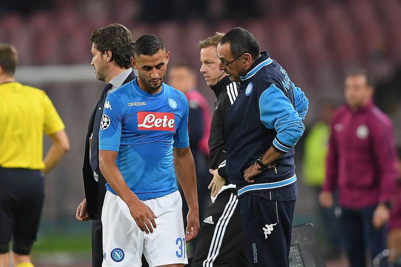 NAPLES, ITALY - NOVEMBER 01: Coach of SSC Napoli Maurizio Sarri and injured player Faouzi Ghoulam during the UEFA Champions League group F match between SSC Napoli and Manchester City at Stadio San Paolo on November 1, 2017 in Naples, Italy. (Photo by F