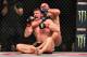 St-Pierre wraps up the rear-naked choke on a stunned Bisping.