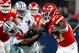 ARLINGTON, TX - NOVEMBER 05: Kareem Hunt #27 of the Kansas City Chiefs holds off Byron Jones #31 of the Dallas Cowboys on a carry in the second half of a football game at AT&T Stadium on November 5, 2017 in Arlington, Texas. (Photo by Ron Jenkins/Getty