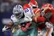 ARLINGTON, TX - NOVEMBER 05: Ezekiel Elliott #21 of the Dallas Cowboys fights his way past Kansas City Chiefs defenders in the fourth quarter of a football game at AT&T Stadium on November 5, 2017 in Arlington, Texas. (Photo by Ronald Martinez/Getty Image