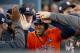 LOS ANGELES, CA - NOVEMBER 01: George Springer #4 of the Houston Astros celebrates with his teammates in the dugout after scoring off of a single hit by Alex Bregman #2 iin the first inning and reaches second safely on a throwing error against the Los An