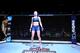 NEW YORK, NY - NOVEMBER 04: Rose Namajunas
enters the octagon for herUFC women's strawweight championship bout against Joanna Jedrzejczyk of Polandduring the UFC 217 event at Madison Square Garden on November 4, 2017 in New York City. (Photo by Josh Hedg