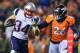 DENVER, CO - NOVEMBER 12: Running back Rex Burkhead #34 of the New England Patriots runs for a touchdown after a catch in the first quarter of a game as free safety Darian Stewart #26 of the Denver Broncos pursues at Sports Authority Field at Mile High o