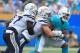 CARSON, CA - SEPTEMBER 17: Joey Bosa #99 of the Los Angeles Chargers tackles Kenyan Drake #32 of the Miami Dolphins during the the first half of the NFL game at the StubHub Center on September 17, 2017 in Carson, California. (Photo by Sean M. Haffey/Get