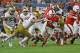 MIAMI GARDENS, FL - NOVEMBER 11: Travis Homer #24 of the Miami Hurricanes runs with the ball past Drue Tranquill #23 of the Notre Dame Fighting Irish on November 11, 2017 at Hard Rock Stadium in Miami Gardens, Florida. Miami defeated Notre Dame 41-8. (Pho
