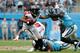 CHARLOTTE, NC - NOVEMBER 05: Devonta Freeman #24 of the Atlanta Falcons runs the ball against Mike Adams #29 of the Carolina Panthers in the fourth quarter during their game at Bank of America Stadium on November 5, 2017 in Charlotte, North Carolina. (Ph