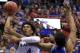Devonte' Graham and his backcourt teammates struggled offensively against the Wildcats but were still able to scratch out a 65-61 win.